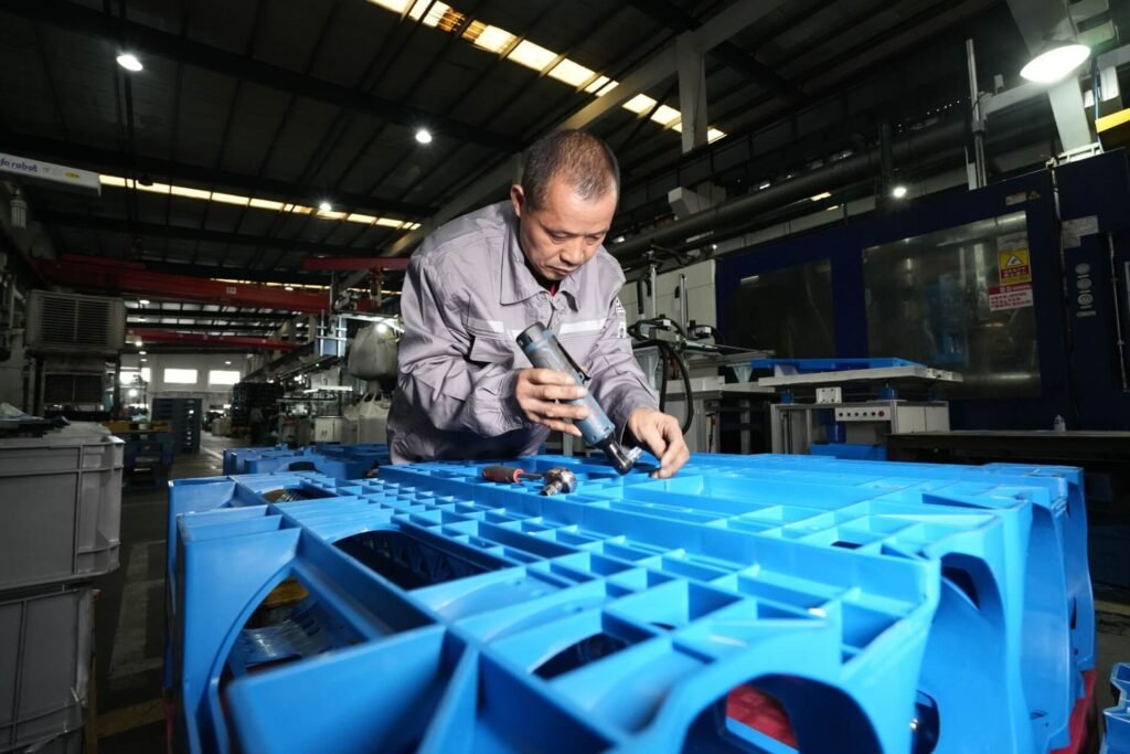 A Preface Plast Worker on a Plastic Pallet in workshop
