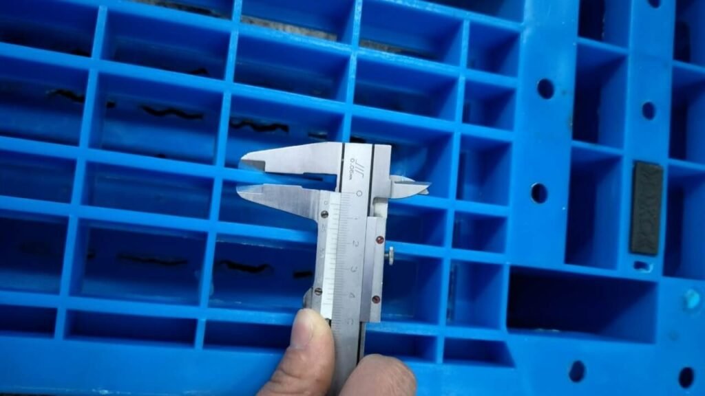 Vernier caliper testing plastic pallet dimensional accuracy